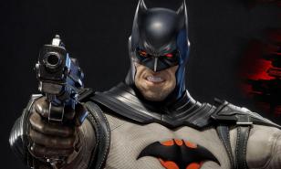 Batman holding a gun